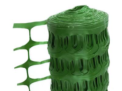 Green extruded plastic barrier fence with oval opening.