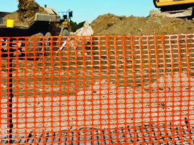 International orange barrier safety fence for construction sites.